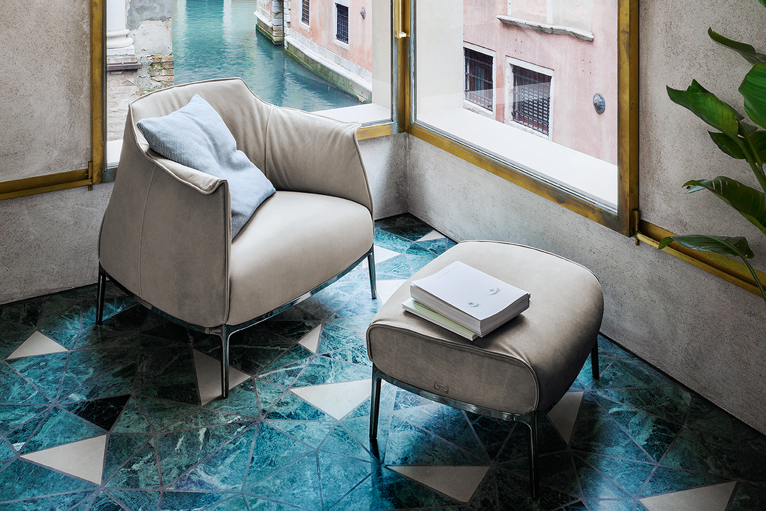 Archibald pouf by Poltrona Frau, with leather upholstery and artisanal details, iconic and comfortable design