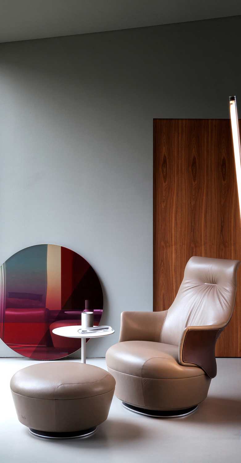 Assaya | Armchair Assaya armchair by Poltrona Frau, sculpted shell in Saddle Extra leather and Pelle Frau® leather or fabric, contrast stitching, luxury Italian design by Satyendra Pakhalé