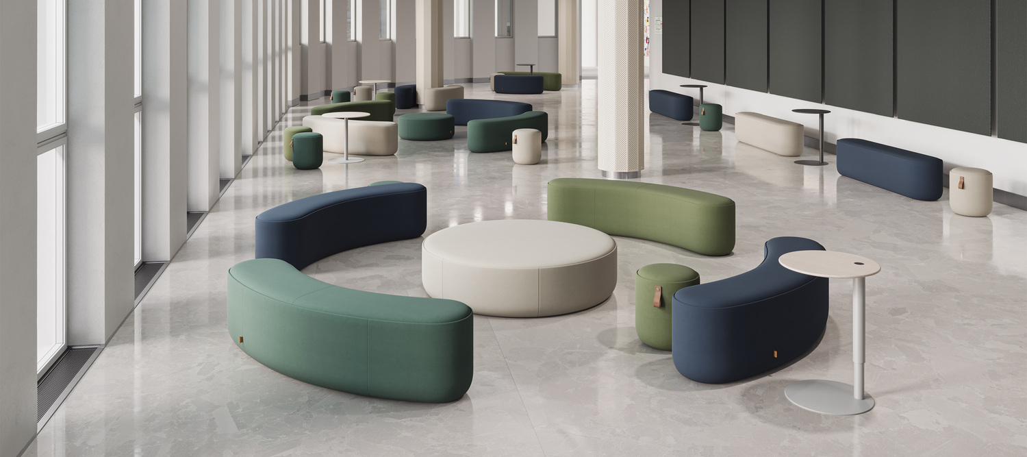 The Bay System accessories by Poltrona Frau complete the collection with modular ottomans and tables made from fine materials, perfect for elegant and versatile spaces.