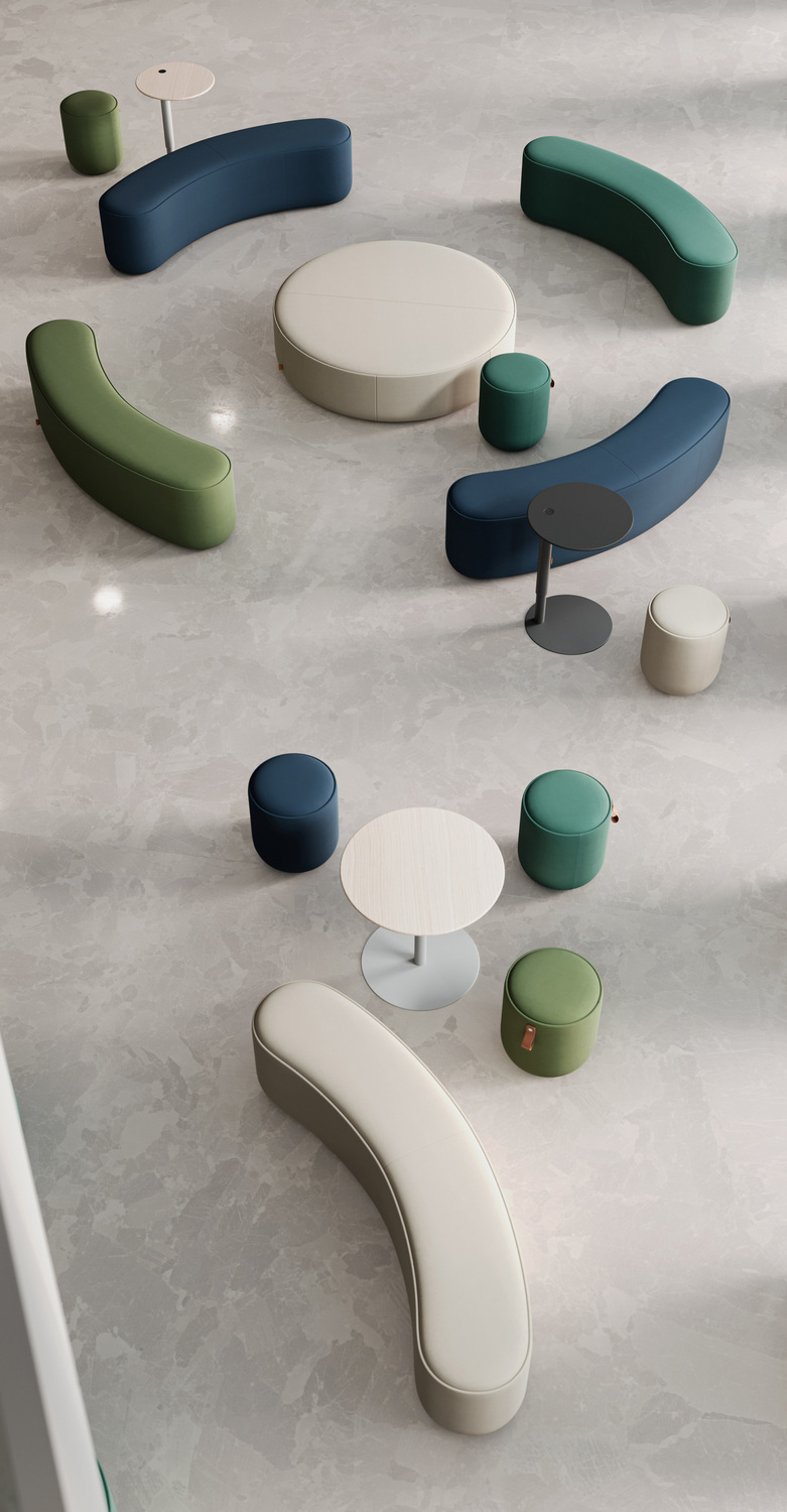 The Bay System accessories by Poltrona Frau complete the collection with modular ottomans and tables made from fine materials, perfect for elegant and versatile spaces.