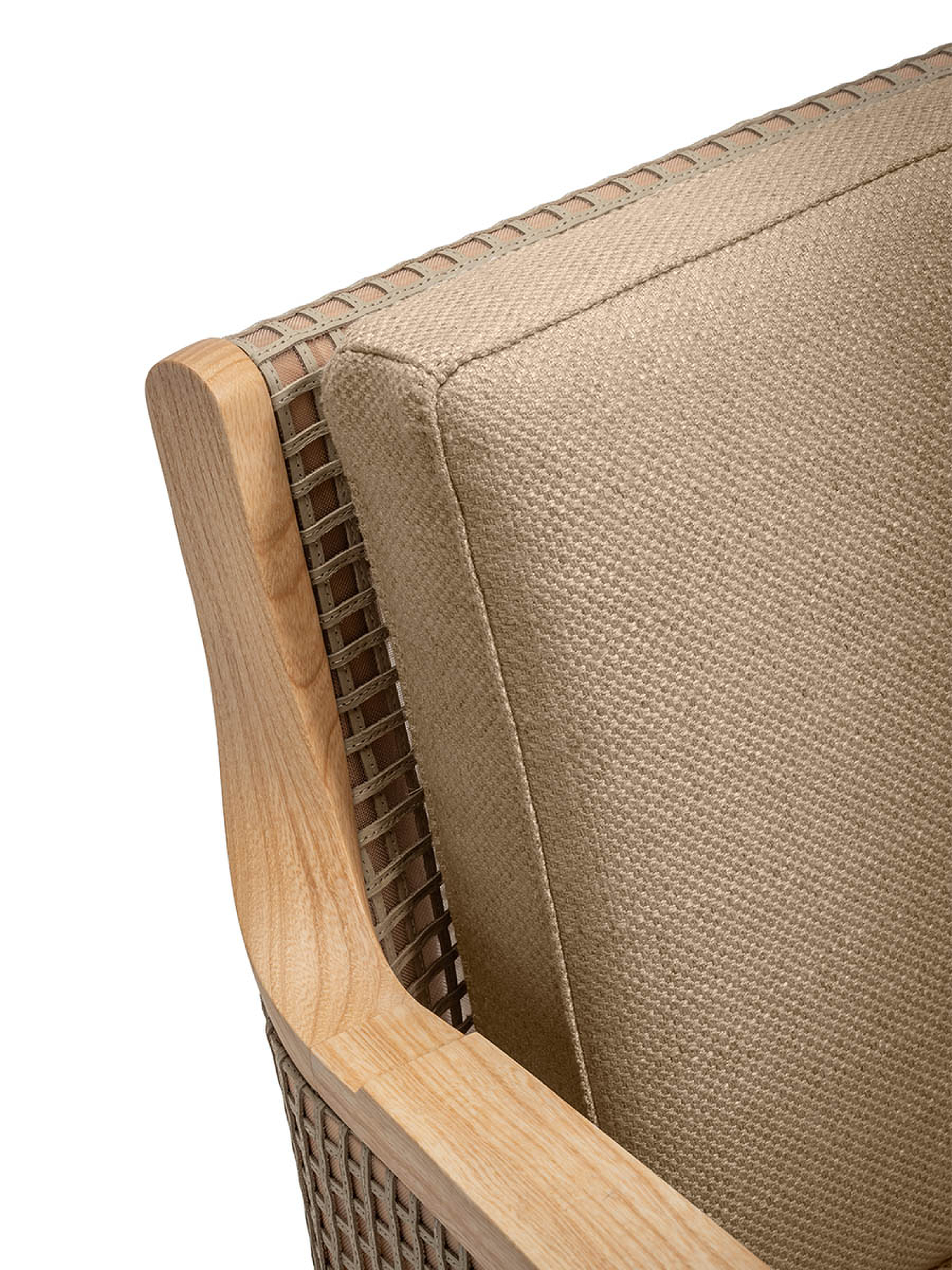 Close-up detail of the woven texture and wooden frame on an armchair.