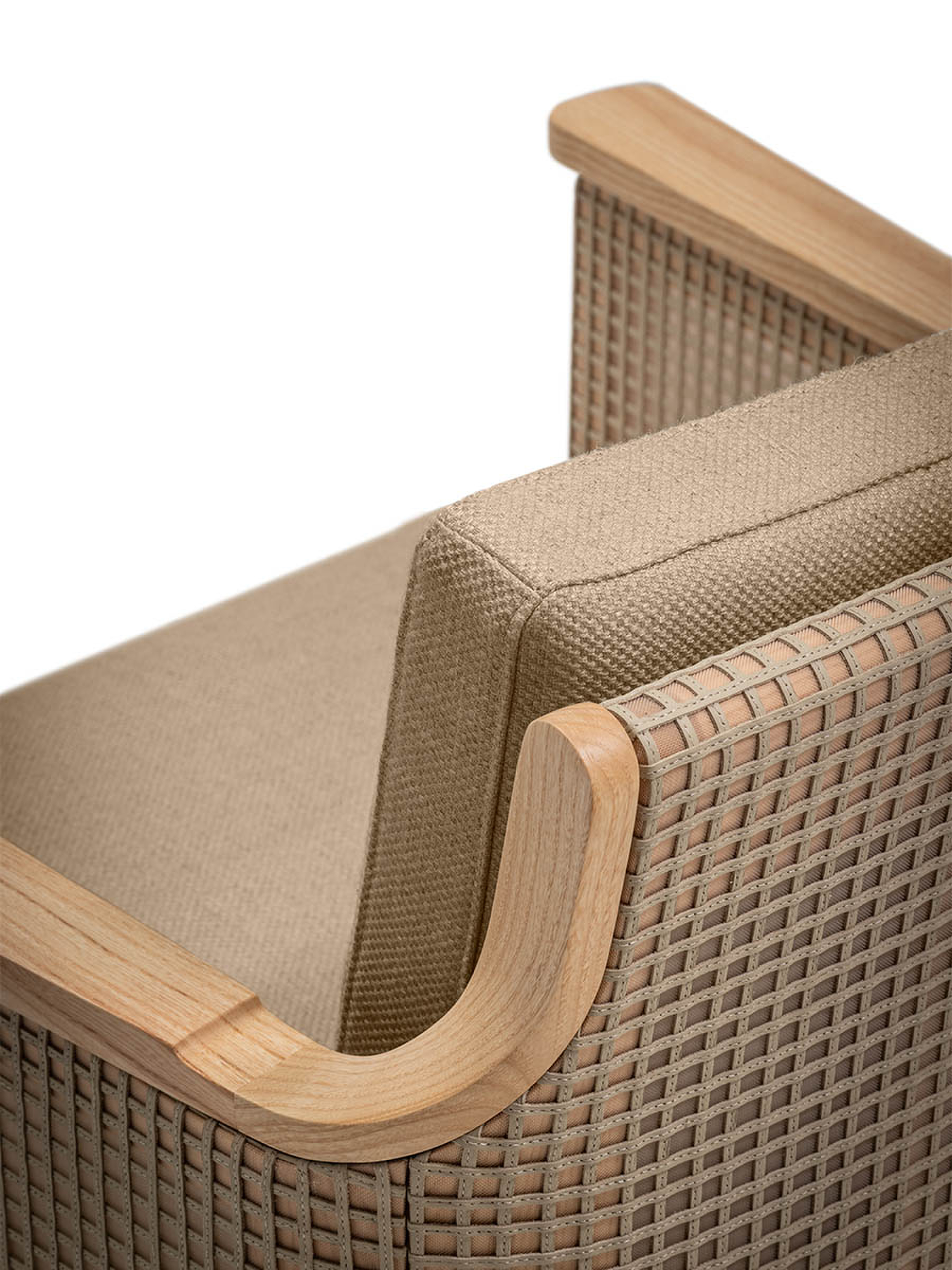 Close-up detail of the wooden frame and woven upholstery on an armchair.
