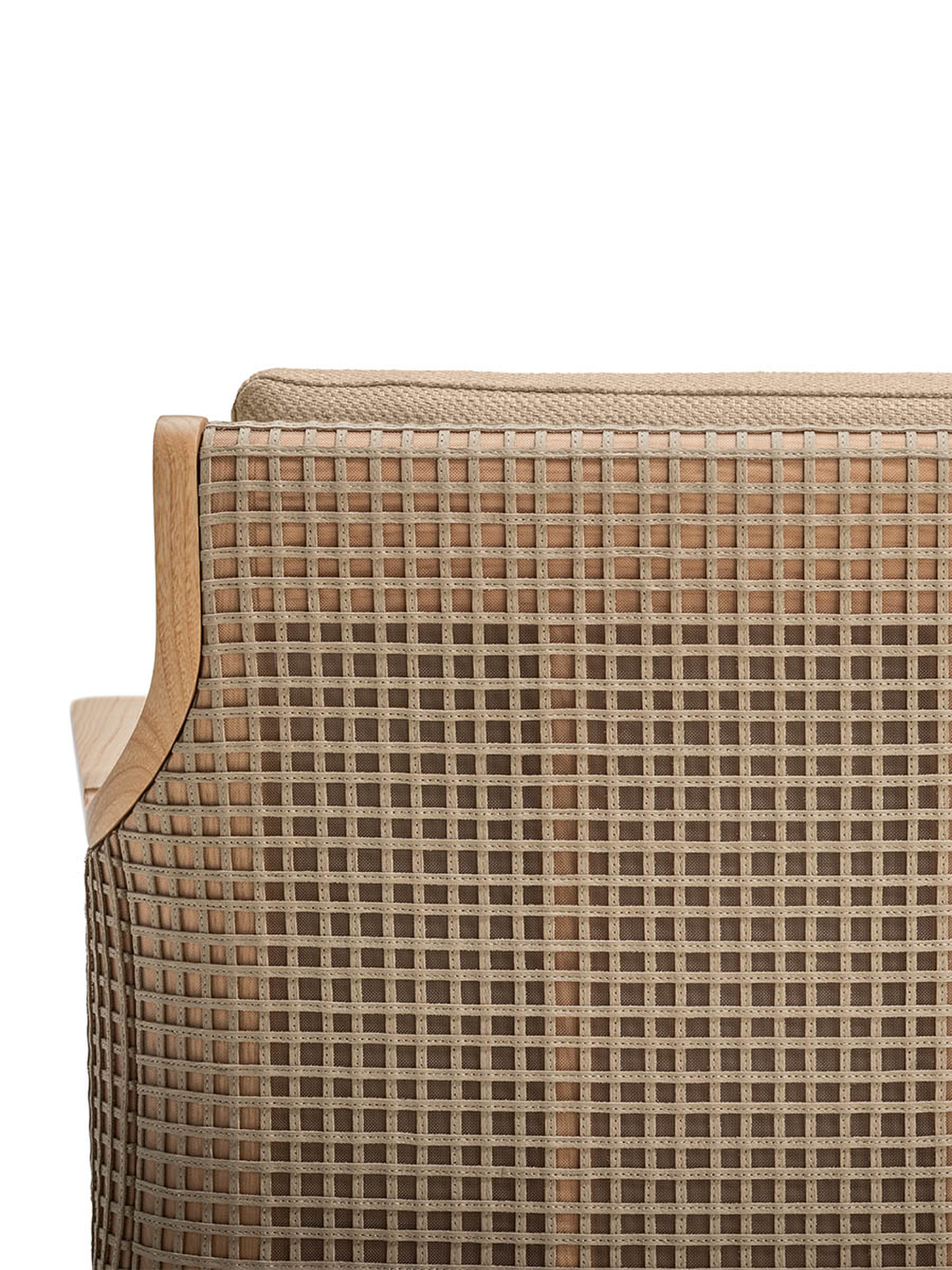 Close-up detail of the woven texture on the backrest of an armchair.