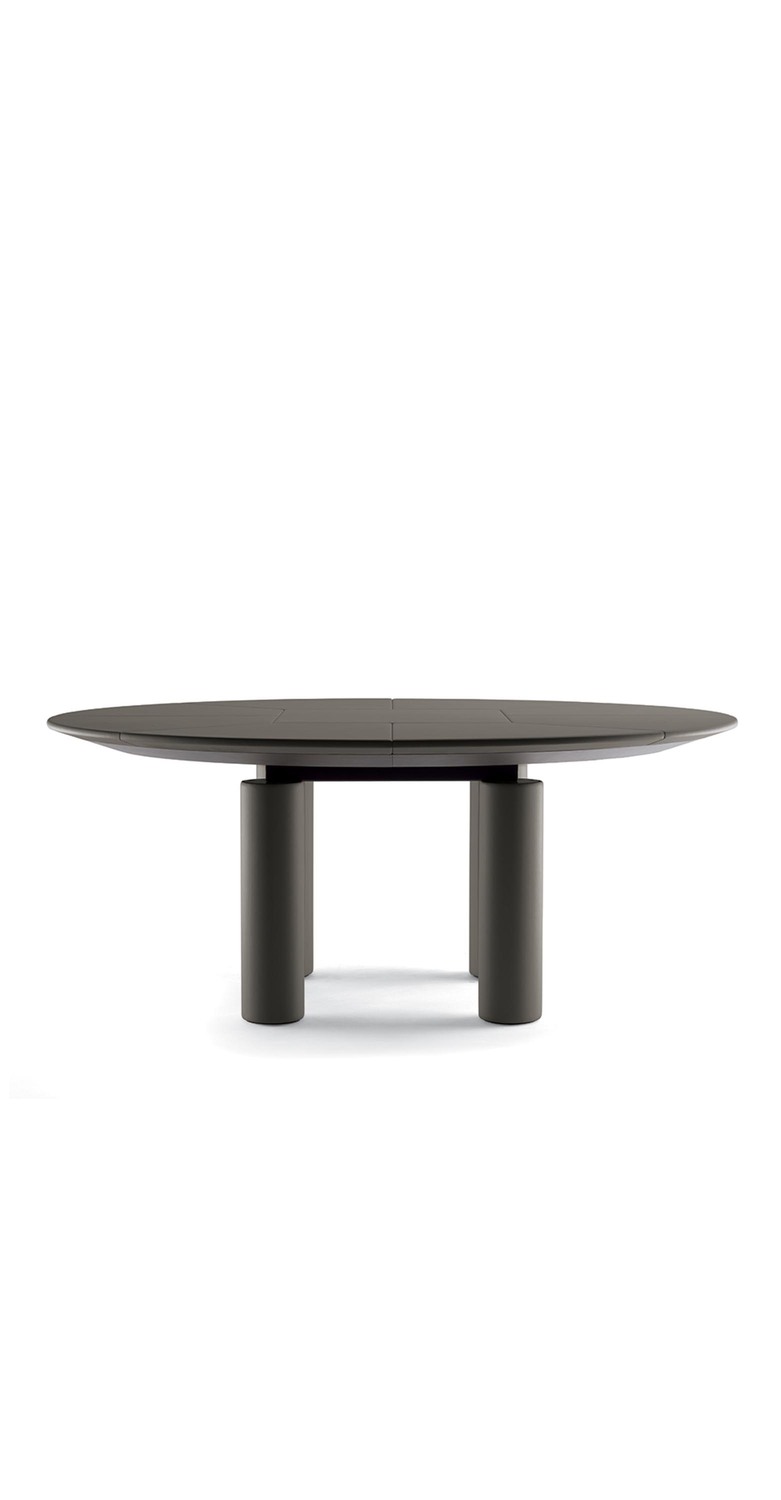 Ceo Cube | Round meeting table Ceo Cube round meeting table by Poltrona Frau, design by Lella and Massimo Vignelli, lightly padded Pelle Frau® leather top, cylindrical leather-clad legs, advanced cable management