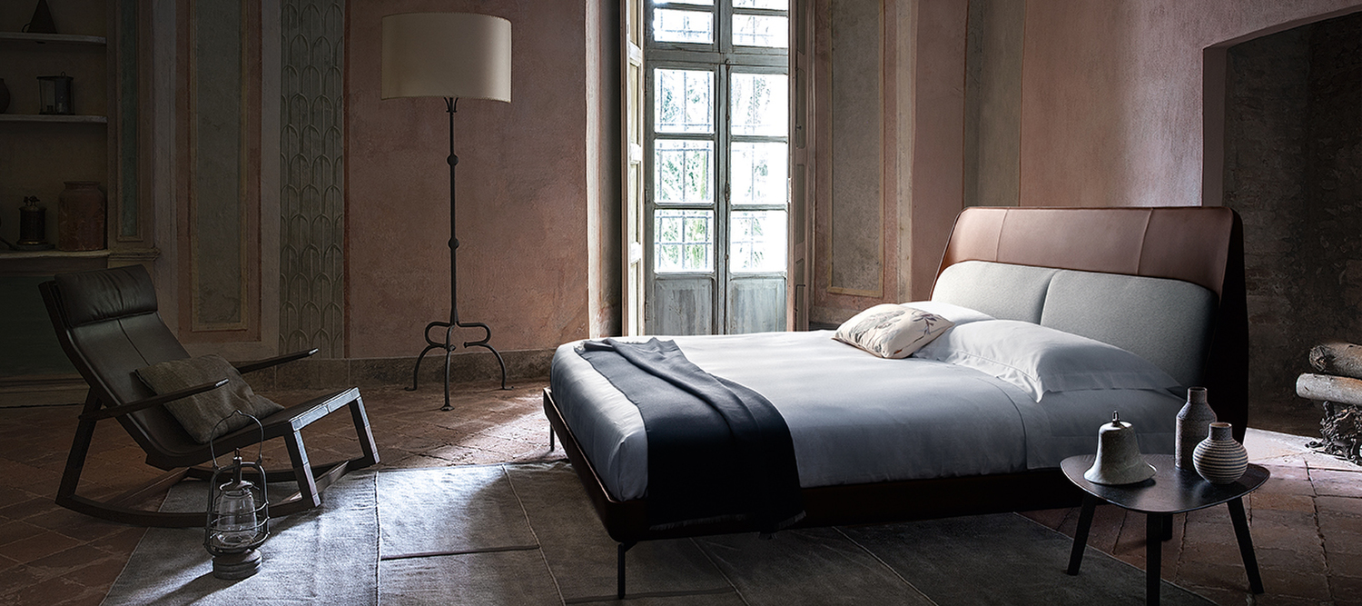Coupè | Bed Coupé bed by Poltrona Frau, Pelle Frau® leather, hand-finished stitching, minimalist design, gunmetal steel feet, soft padded headboard