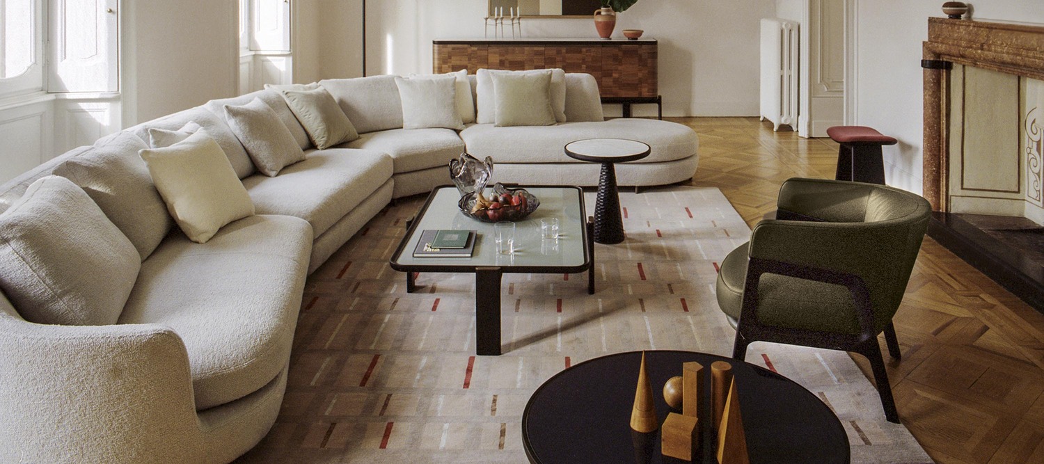 DUO sofa by Poltrona Frau, modular and upholstered in Pelle Frau® or fabric, featuring a curved and sophisticated design