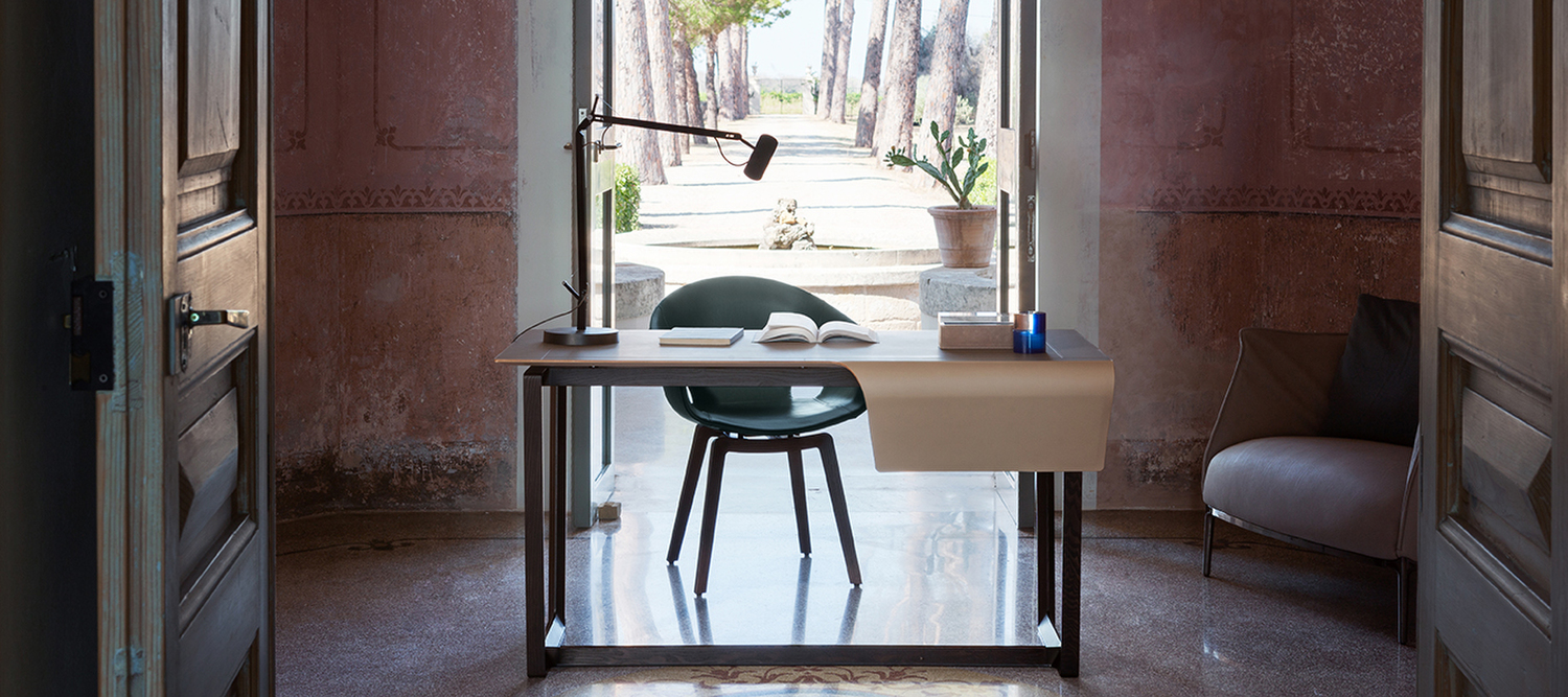 Fred | Desk Fred desk by Poltrona Frau in solid moka-stained ash with seamless Saddle Extra leather top, expression of Italian elegance and outstanding design