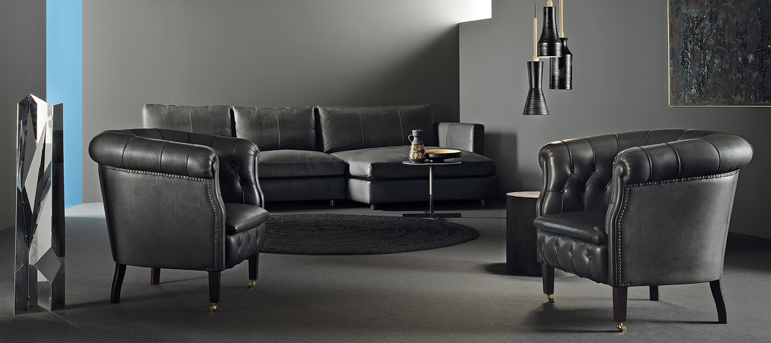Fumoir | Armchair Fumoir armchair by Poltrona Frau with seasoned beech structure, diamond-pattern stitching, Pelle Frau® covered buttons and brass wheels, expression of Italian elegance and outstanding design