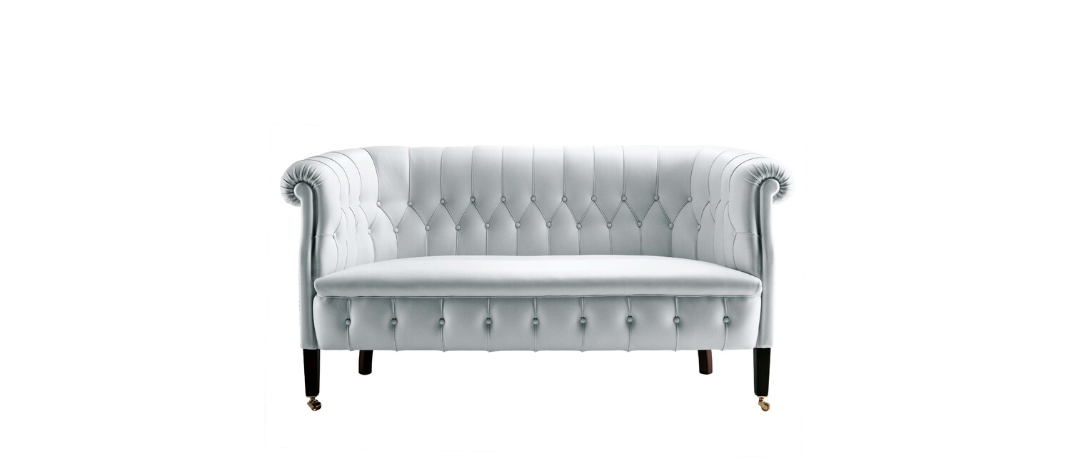 Fumoir sofa by Poltrona Frau with seasoned beech frame, diamond-stitched backrest, Pelle Frau® covered buttons, brass wheels and iconic Italian design elegance