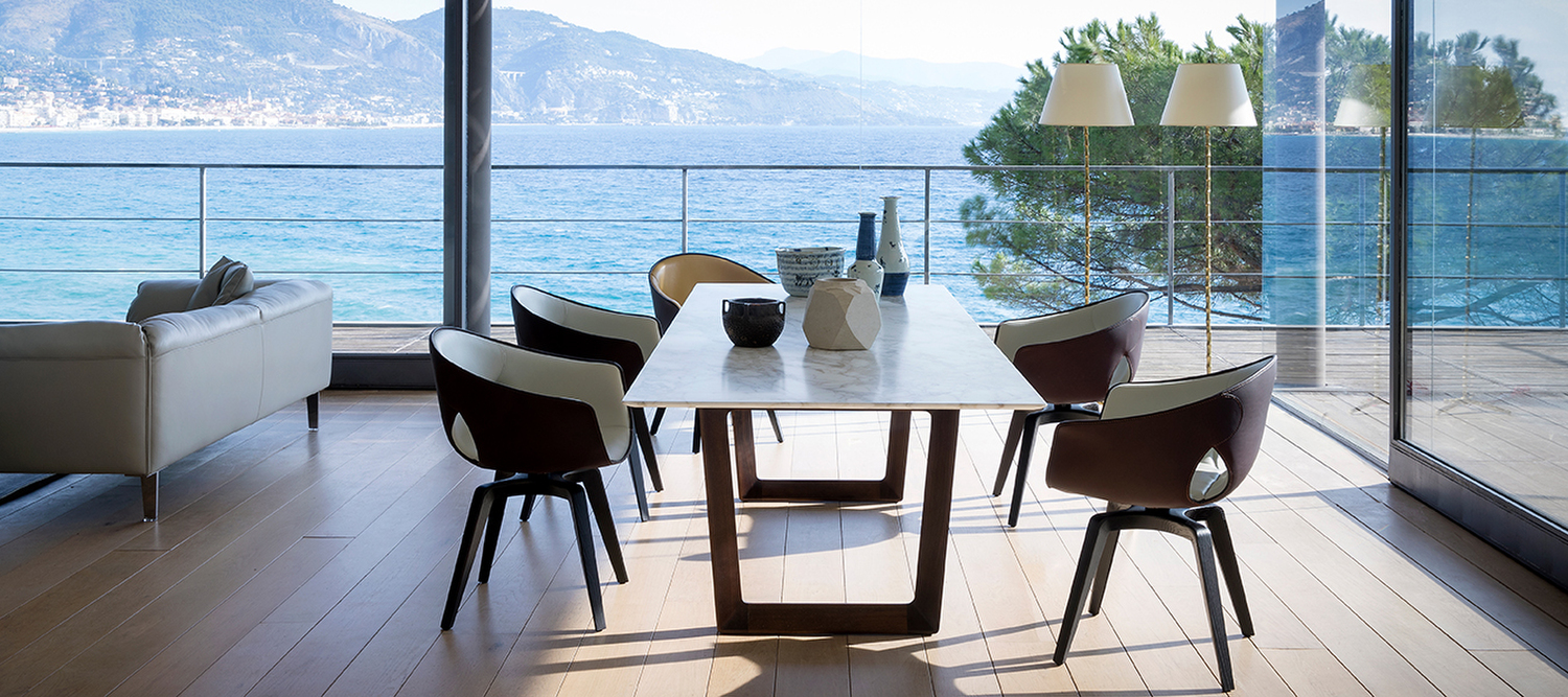 Ginger | Small armchair Ginger by Poltrona Frau is a refined armchair with a molded plywood frame, a leather-covered shell, and an interior in Pelle Frau® leather or fabric.