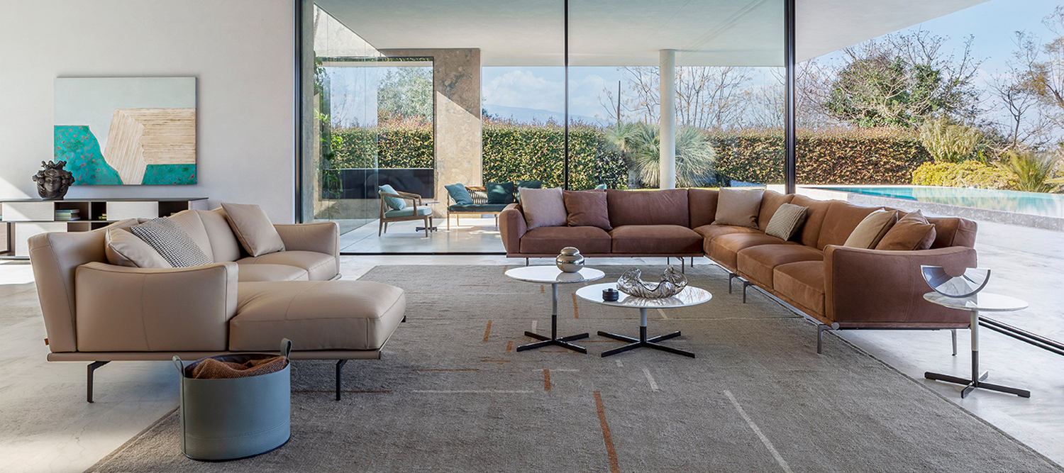 Happy Jack sofa by Poltrona Frau in black Pelle Frau® leather, leather-clad aluminum base, curved wrap-around cushions, electric reclining chaise longue, Italian luxury design