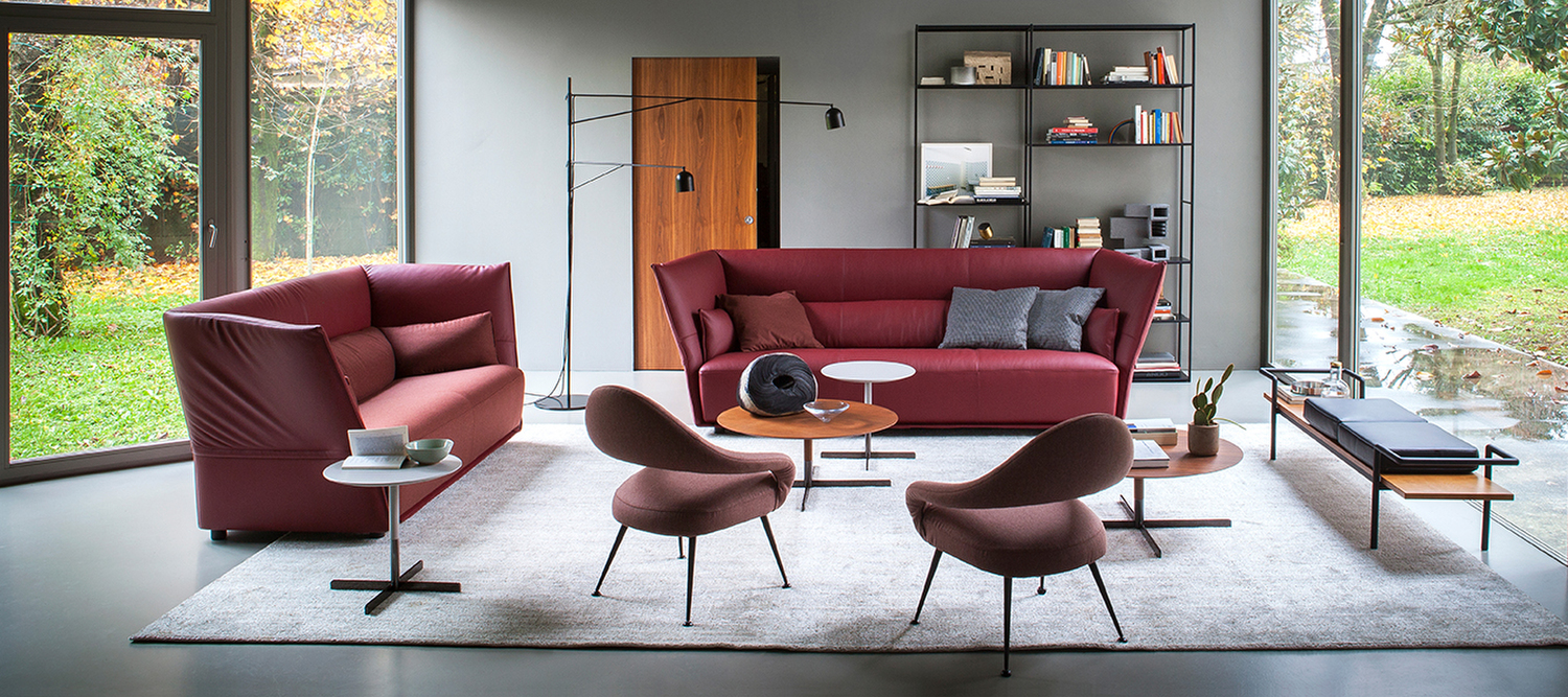 Letizia | Armchair Letizia armchair by Poltrona Frau, in leather or fabric, with sinuous lines inspired by 1950s design