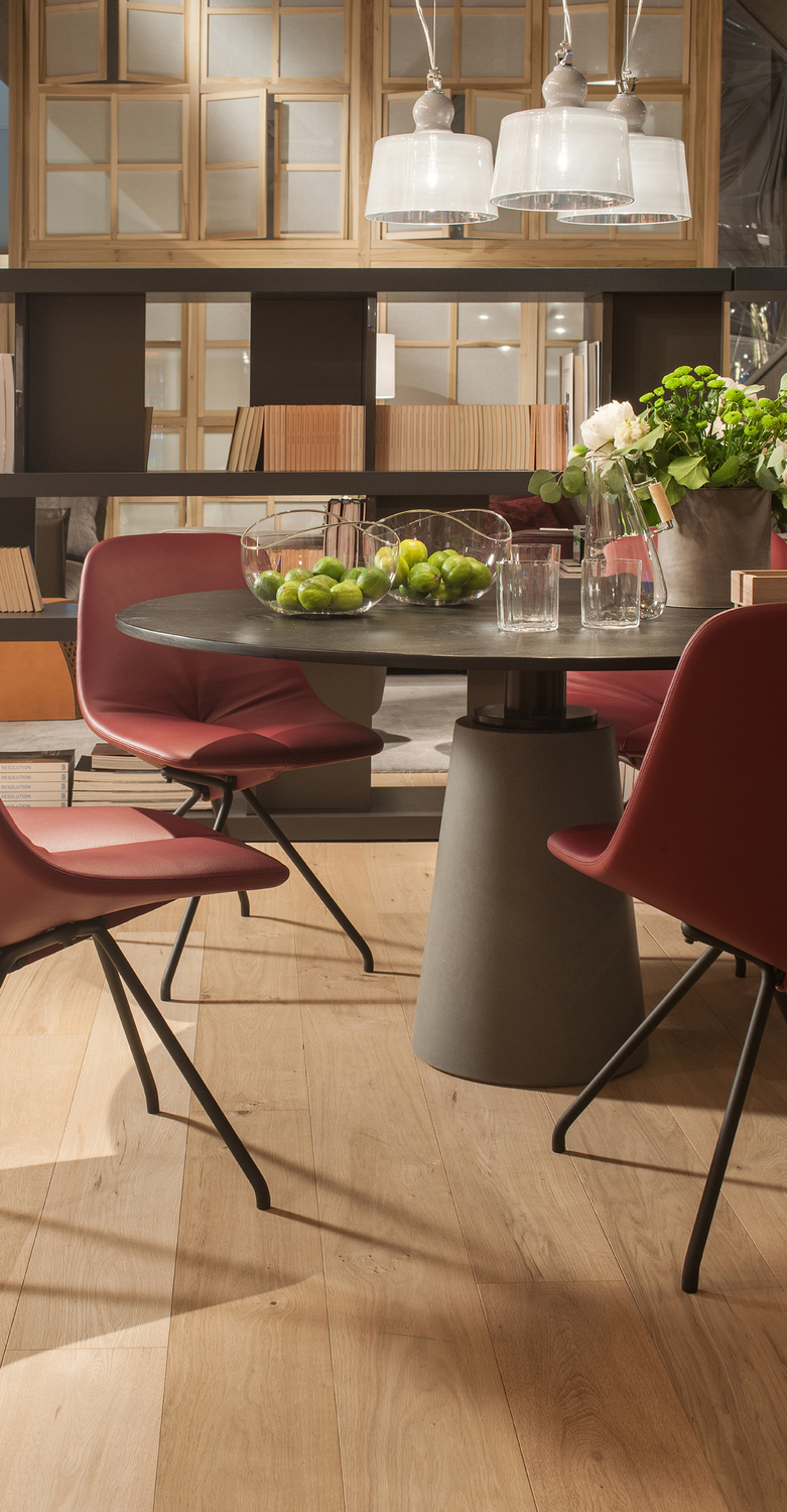 Mesa | Round table Mesa Round Table by Poltrona Frau, Ligurian split slate top, grey Pietra Serena stone column, excellence of Italian design