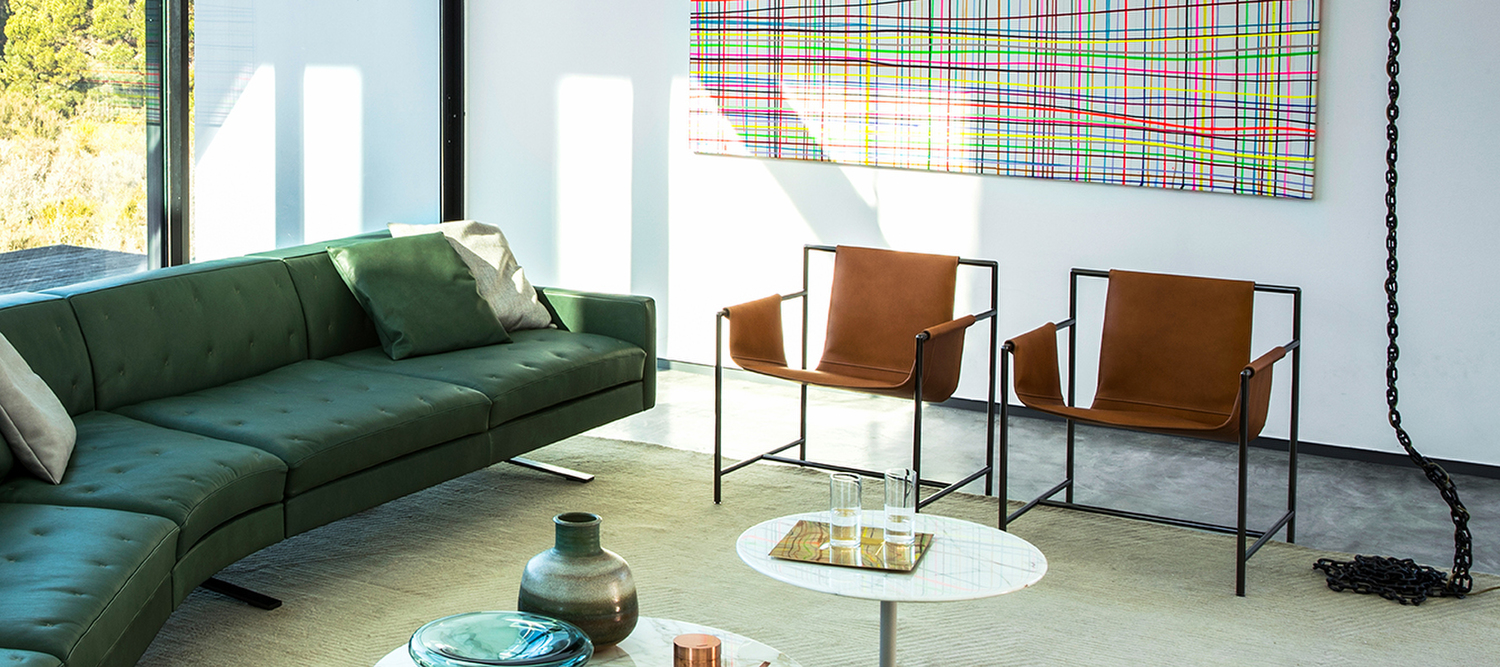 Ming's Heart | Armchair Ming’s Heart Armchair by Poltrona Frau, gunmetal grey tubular steel frame, steel shell upholstered in Saddle Extra leather with contrast stitching, essential East-West design, Italian luxury craftsmanship