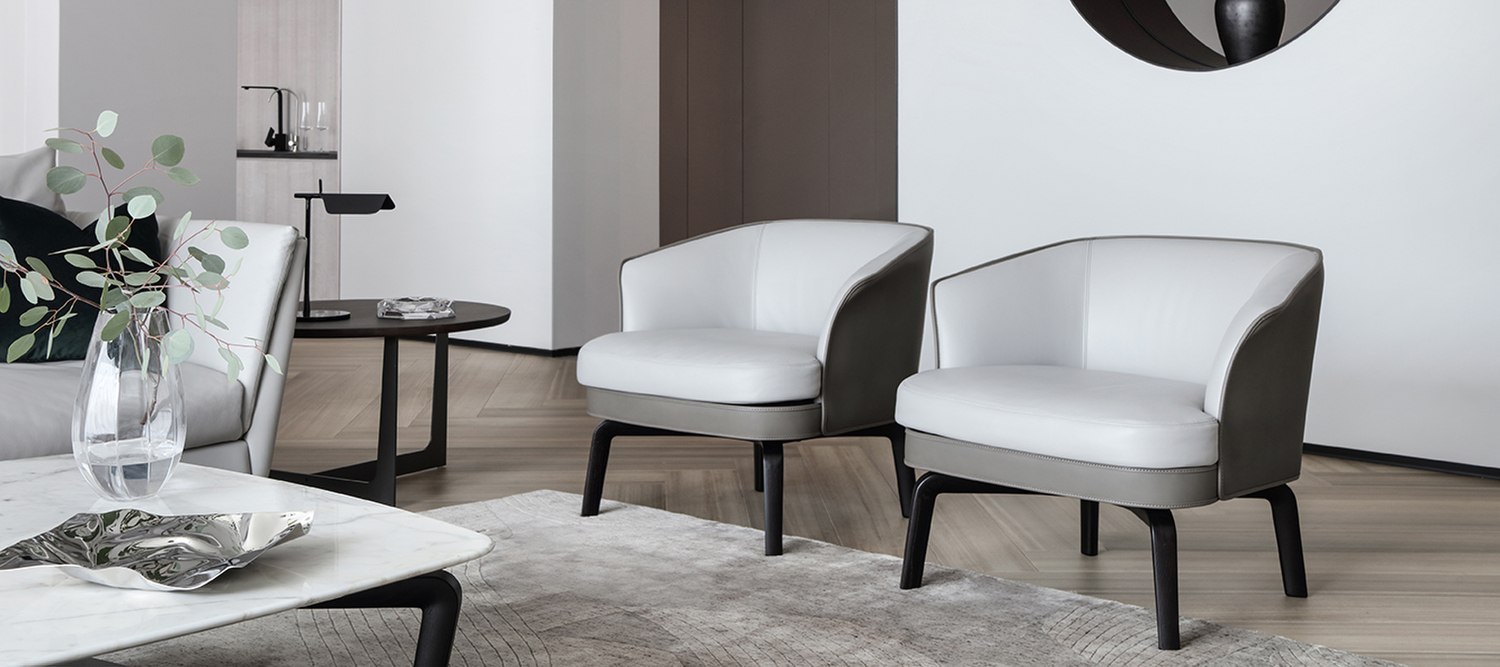 Nivola | Armchair Nivola armchair by Poltrona Frau, Roberto Lazzeroni design, upholstered in Pelle Frau® leather, ash wood frame, contrast stitching, Italian artisanal comfort