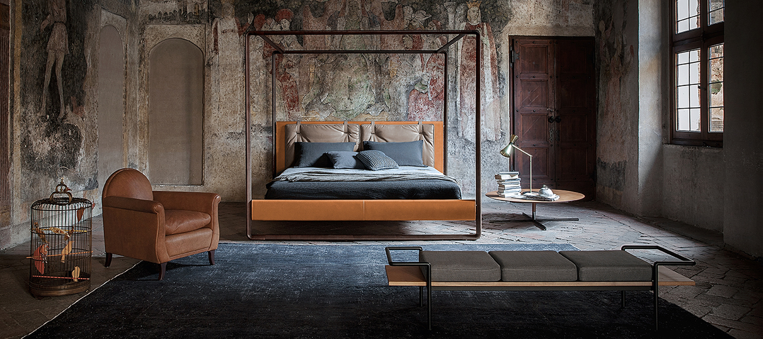 Volare | Bed Volare by Poltrona Frau is the canopy bed designed by Roberto Lazzeroni, featuring a solid ashwood frame and upholstery in Pelle Frau® leather, saddle leather, or fabric, creating a balance between elegance and craftsmanship.