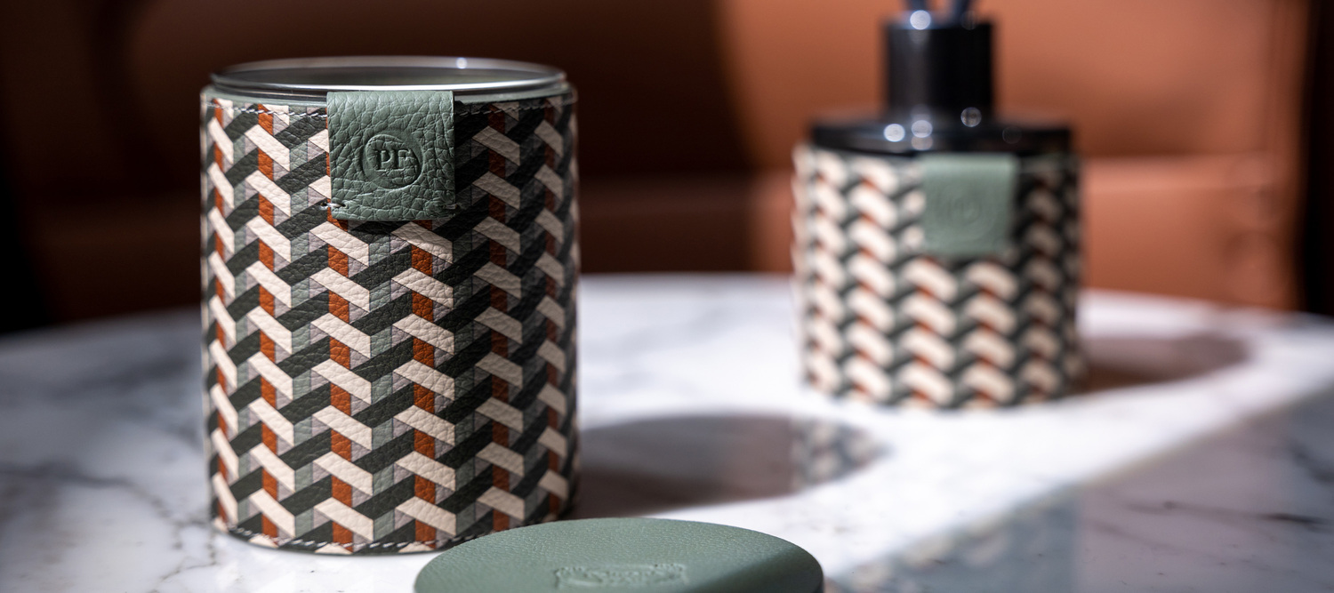 Weavers Home Fragrance | Candle Weavers Home Fragrance is the Poltrona Frau candle wrapped in Pelle Frau® leather, available in the refined scents Saffron Breeze and Pink Pepper Touch.